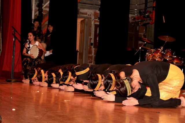 Singing and Playing “Gendang” for the Saman dance (far left)