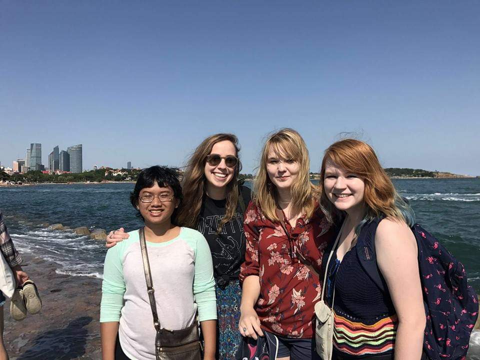 Inef with her classmates in Qingdao, Shandong province, China. They visited a beach that has a historical pier dating back to the Germany invasion of Qingdao. This group travel was a part of the mandatory UNCA requirements for all International Studies majors.